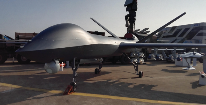 Chinese-made CH-5 (Caihong-5) reconnaissance and combat drone and its compatible missiles on display during 11th China InternationalAviation and Aerospace Exhibition in Zhuhai, Guangdong Province, November 1, 2016 (Imaginechina/Alamy)